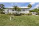Front exterior of property with a manicured lawn at 232 Cerromar Way # 38, Venice, FL 34293