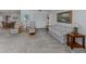 Open-concept living space with a blend of seating arrangements and natural light, ideal for gatherings at 232 Cerromar Way # 38, Venice, FL 34293