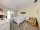 Bedroom featuring a ceiling fan, closet, and sliding door access to the lanai at 232 Cerromar Way # 38, Venice, FL 34293
