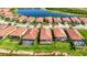 Aerial view of a home, highlighting the spacious backyard, screen lanai, and community layout at 23493 Copperleaf Dr, Venice, FL 34293