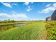 Beautiful backyard view overlooking the scenic greenery, water and plants at 23493 Copperleaf Dr, Venice, FL 34293