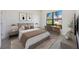 The bedroom has a comfortable bed, a well-lit desk area, and ample natural light from a large window at 23493 Copperleaf Dr, Venice, FL 34293