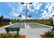 Bocce ball courts with seating and landscaping provide a relaxing space for community recreation at 23493 Copperleaf Dr, Venice, FL 34293