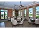 Well-lit dining room with views of the outdoors, providing an inviting space for residents to socialize and dine at 23493 Copperleaf Dr, Venice, FL 34293