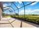 A covered lanai with brick floors and a beautiful view at 23493 Copperleaf Dr, Venice, FL 34293