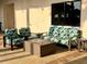 Inviting patio area with plush seating and a cozy fire pit, ideal for outdoor entertaining at 23493 Copperleaf Dr, Venice, FL 34293