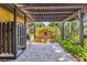 Backyard patio with water feature and mature landscaping at 236 Cory St, Port Charlotte, FL 33953