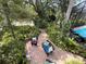 Tranquil backyard with brick patio, comfortable seating, and serene river views at 236 Cory St, Port Charlotte, FL 33953