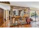 Charming bar area showcasing a stone structure with seating connecting the kitchen and living spaces at 236 Cory St, Port Charlotte, FL 33953