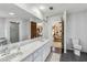 Bright bathroom featuring dual sinks, neutral tiling and glass shower at 236 Cory St, Port Charlotte, FL 33953