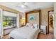 Cozy bedroom with large windows, a murphy bed, and a closet at 236 Cory St, Port Charlotte, FL 33953