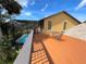 Spacious deck overlooking a screened-in pool, perfect for outdoor entertaining at 236 Cory St, Port Charlotte, FL 33953