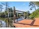 Waterfront home featuring a boat lift and dock on a tranquil canal at 236 Cory St, Port Charlotte, FL 33953