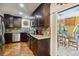 Updated kitchen featuring stainless steel appliances, granite countertops, and access to outdoor living space at 236 Cory St, Port Charlotte, FL 33953