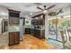 Beautiful kitchen with stainless steel appliances, tiled floors, granite countertops, and dark wood cabinets at 236 Cory St, Port Charlotte, FL 33953