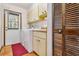Functional laundry area with cabinets, countertop, and tile floors at 236 Cory St, Port Charlotte, FL 33953