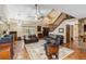 Inviting living room boasts high ceilings, exposed stone, tile floors, and comfortable seating at 236 Cory St, Port Charlotte, FL 33953