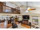 Spacious living room with tile floors, a fan, and a loft view at 236 Cory St, Port Charlotte, FL 33953