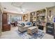 Relaxing living room with built in shelves, desk and ample natural light at 236 Cory St, Port Charlotte, FL 33953
