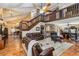 Open-concept living area with high ceilings, tile flooring, and a view to the dining and kitchen areas at 236 Cory St, Port Charlotte, FL 33953
