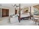 Cozy main bedroom with sofa, four poster bed and multiple windows at 236 Cory St, Port Charlotte, FL 33953