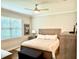 Cozy bedroom with a neutral color palette, wood furnishings, and comfortable bedding at 236 Soliera St, Nokomis, FL 34275