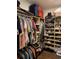 Walk-in closet with built-in shelving and rods for maximum storage and organization at 236 Soliera St, Nokomis, FL 34275