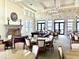 Elegant clubhouse interior with high ceilings, stone accents, a fireplace, and ample seating for social gatherings at 236 Soliera St, Nokomis, FL 34275