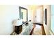 Inviting entryway features a stylish console table with decor and a large decorative mirror at 236 Soliera St, Nokomis, FL 34275