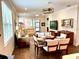 Open-concept living and dining area with tile floors and stylish furnishings at 236 Soliera St, Nokomis, FL 34275