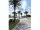 Scenic view of a water fountain feature surrounded by palm trees and lush landscaping within the community at 236 Soliera St, Nokomis, FL 34275