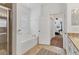 Bright bathroom featuring separate shower, tub, toilet room, and granite-topped sink at 24849 Pennington Ter, Venice, FL 34293