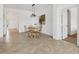 Open concept dining room features tile flooring, a chandelier and natural light at 24849 Pennington Ter, Venice, FL 34293