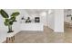 Spacious living area showcasing tile flooring, white walls, and ample natural light at 24849 Pennington Ter, Venice, FL 34293