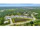 Overhead view of the community, highlighting its location near the lake and lush green surroundings at 25069 Pearl Lake Cir, Englewood, FL 34223