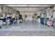 Spacious garage with organized storage solutions, epoxy flooring, and ample room for vehicles at 25069 Pearl Lake Cir, Englewood, FL 34223