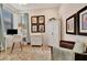 Well-lit home office space with a desk, chair, storage cabinet, and vintage-style chest at 25069 Pearl Lake Cir, Englewood, FL 34223
