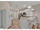 Clean, white kitchen with stainless appliances, ample counter space, and modern finishes at 25069 Pearl Lake Cir, Englewood, FL 34223