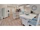 Open-concept living space featuring dining area with a clear view to the living room at 25069 Pearl Lake Cir, Englewood, FL 34223