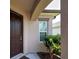 Inviting front entrance with a well-kept lawn and colorful plants at 25784 Grayton Ave, Englewood, FL 34223