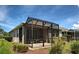 Covered screened-in patio offering a relaxing outdoor living space at 25784 Grayton Ave, Englewood, FL 34223