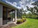 Screened-in lanai perfect for enjoying the outdoors with lush landscaping at 25784 Grayton Ave, Englewood, FL 34223