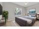 Serene bedroom with a plush bed, neutral tones, and ample natural light creating a relaxing retreat at 2614 River Preserve Ct # 2614, Bradenton, FL 34208