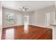 Bright living room featuring hardwood floors, two windows and a ceiling fan at 2614 River Preserve Ct # 2614, Bradenton, FL 34208