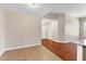 Open concept living area with hardwood flooring and access to other rooms at 2614 River Preserve Ct # 2614, Bradenton, FL 34208