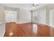 Spacious living area with wood floors, a ceiling fan, and large windows for plenty of natural light at 2614 River Preserve Ct # 2614, Bradenton, FL 34208