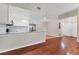 Open-concept living space with hardwood floors and a modern, updated kitchen at 2614 River Preserve Ct # 2614, Bradenton, FL 34208