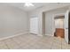 The tiled-floor main bedroom offers natural light with a closet and access to other rooms in the house at 2614 River Preserve Ct # 2614, Bradenton, FL 34208