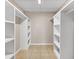 Spacious walk-in closet with built-in shelving and ample storage space at 2614 River Preserve Ct # 2614, Bradenton, FL 34208