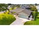 Single Gathering home showcasing a well kept lawn, tidy landscaping, and an extra long driveway at 30 Jamestown Ave, Englewood, FL 34223